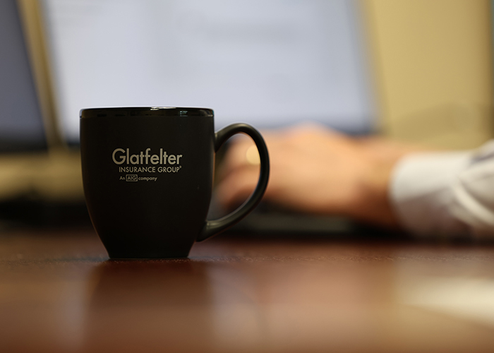 Close up of a yellow mug, featuring the Glatfelter logo